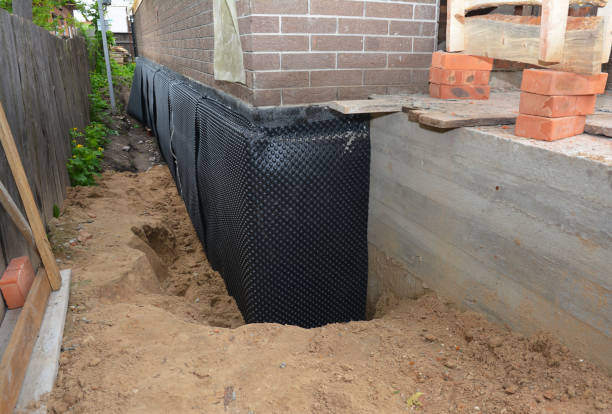 Happy homeowners after waterproofing job in Fletcher
